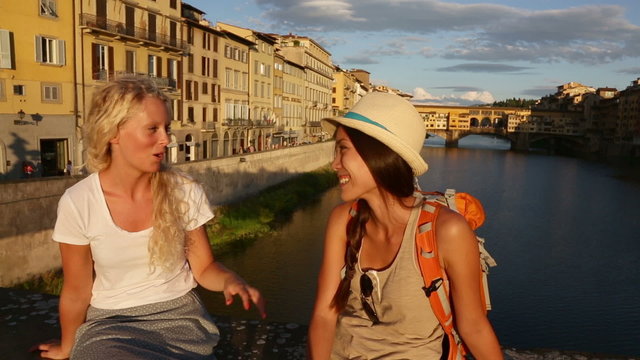 Happy women girl friends on travel in Florence