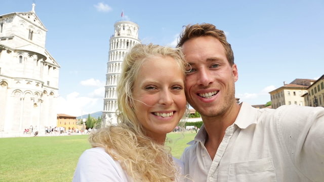 Selfie - couple in love on travel in Pisa, Italy