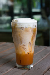 Iced coffee with milk is on the table.