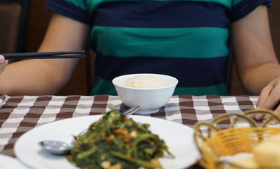 Eating rice with other food in asian style