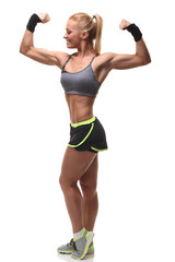 Fototapeta premium Attractive athletic girl showing biceps