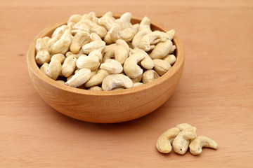 Cashew nuts in a wooden bowl