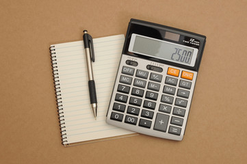 Calculator with pen and note book