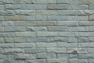 Part of gray square stone wall for background and texture