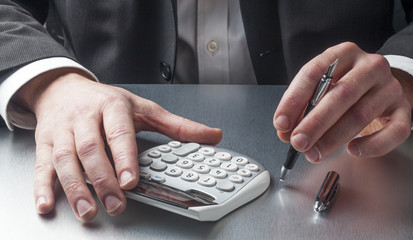 finance mananger counting with calculator