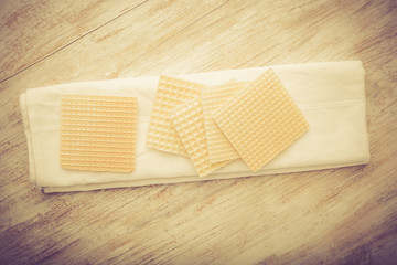 Vintage photo of wafers on white wooden table