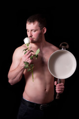 Man with frying pan and a flower
