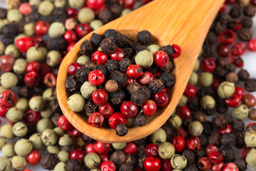 Pepper seasoning mix in wooden spoon