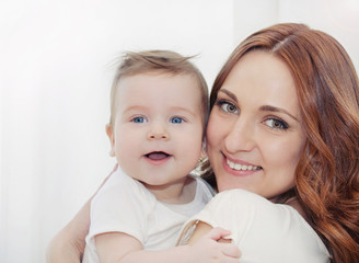 happy family potrait of beautiful young mother and her cute litt