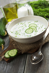 Summer soup with cucumbers, yogurt and fresh herbs