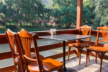 wooden table and chair on the terrace