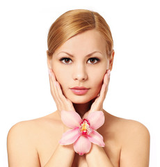 Beautiful young woman holding orchid flower, isolated