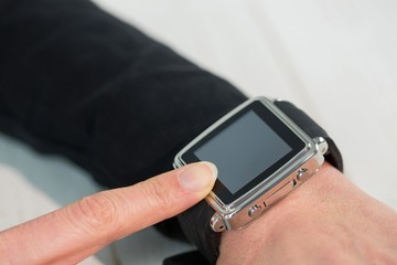 Businesswoman using a smart watch