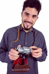 Casual man holding his camera