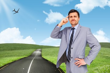 Composite image of thinking businessman