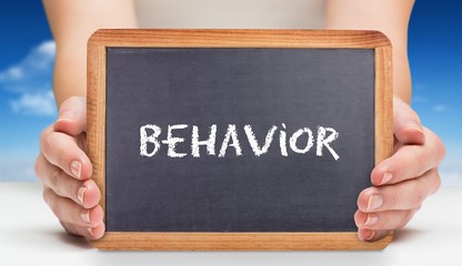 Behavior against bright blue sky with clouds