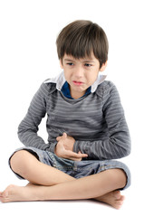 Little boy has stomach ache on white background