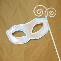 Venice carnival mask pearl on crumpled paper brown background