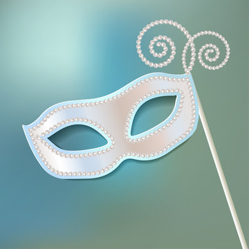 Venice carnival mask pearl on blue bokeh background