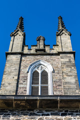 Fototapeta na wymiar Old Wood Window in Stone Church Tower