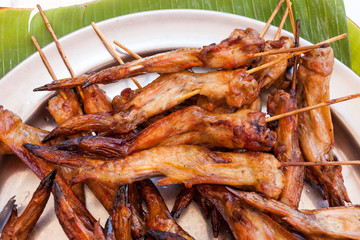 baked fried chicken wings carcass on metal Plate