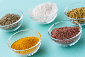 Supplement food powders in glass bowls superfoods