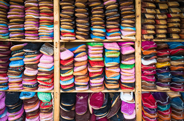 Fototapeta na wymiar Medina souk Fez, artisan shop of moroccan leather sleepers