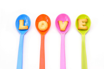 Alphabet Biscuits , word " LOVE " in colorful spoons
