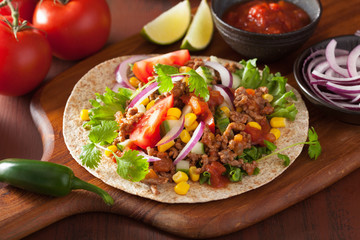mexican taco with beef tomato salasa onion corn