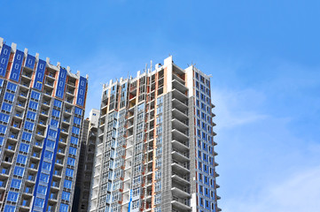 Building construction site work against blue sky