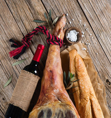 Serrano ham, wine and  bread top view