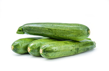 Fresh healthy green zucchini isolated on white background .