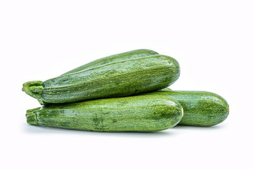 Fresh healthy green zucchini isolated on white background .