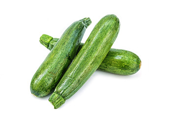 Fresh healthy green zucchini isolated on white background .