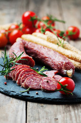 Salami on the wooden table