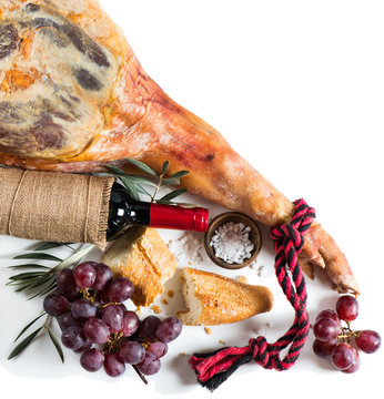 Jamon Cured Spanish, wine and grapes, top view