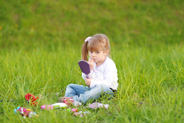 portrait of little girl outdoors in summer