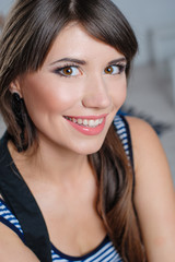 Naklejka premium Beautiful happy woman posing in studio closeup