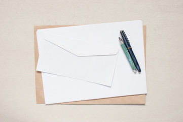 Empty envelope and sheet of paper on the table