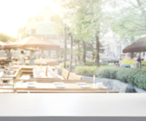 Table Top And Blur Building Background