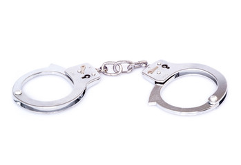 Closed handcuffs on white background