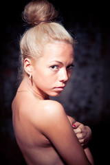 Fototapeta premium Undressed young women on wall background