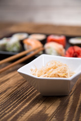 Fresh platter of bean sprouts with chopsticks on wooden table
