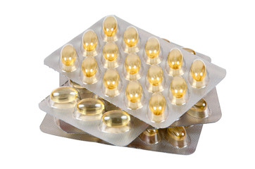 Cod liver oil capsules on white background