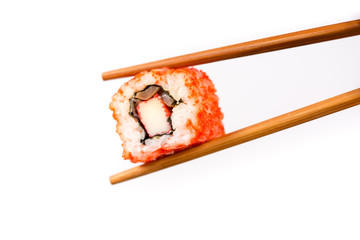 Sushi roll with bamboo chopsticks isolated on white background