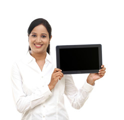 Young business woman showing tablet computer against white - 81673980