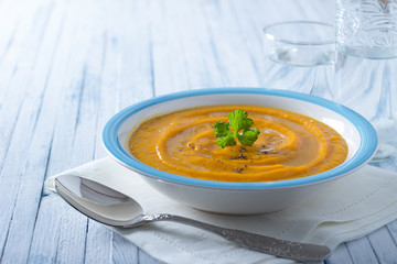 Carrot cream soup with spices and parsley