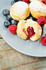 Traditional danish pancakes - ebelskivers with fresh berries