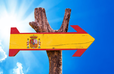 Spain Flag wooden sign with sky background