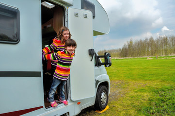Kids in camper (rv), family travel in motorhome on vacation